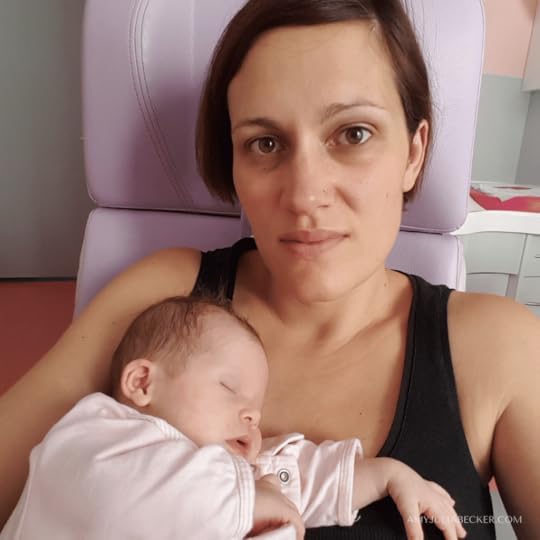 photo of Anne holding her baby daughter in the hospital