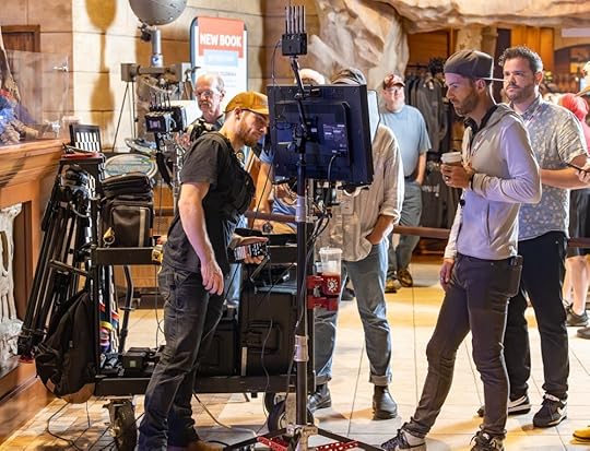 Video production crew reviewing monitor