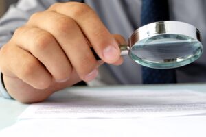cop examining ballistic report