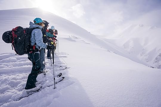 skiers atop ski line in kyrgyzstan