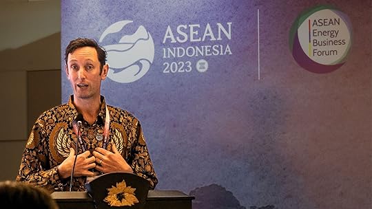Andrew Hudson, CEO of Centre for Policy Development, in a batik shirt stands at a podium giving a speech. The background behind him reads ASEAN Indonesia 2023.