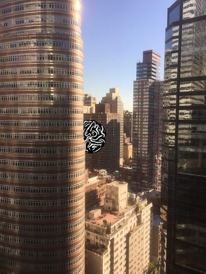 A visitor peeks out from behind an office tower in midtown Manhattan.