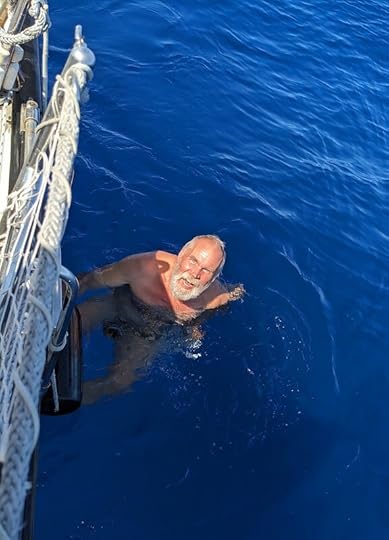 James swimming in the middle of the ocean