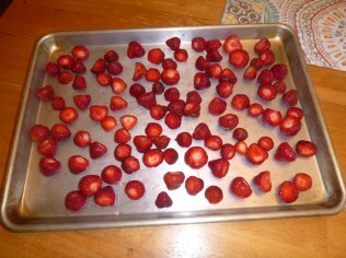 many strawberries on a sheet pan