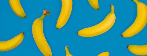 Lots of bananas on a blue background to illustrate the blog post 