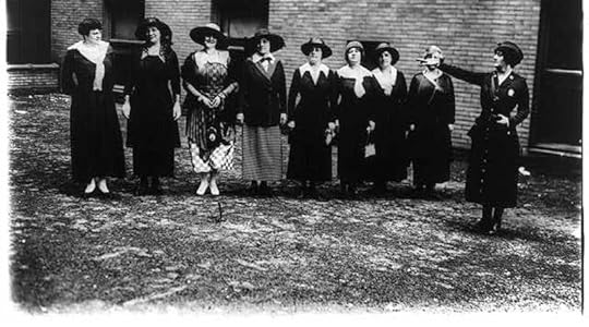 A women's equality day button with a red, white and blue background.