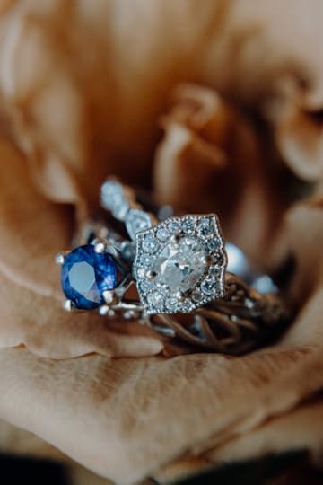 Two engagement rings (one sapphire, one diamond)