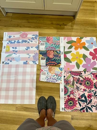 The image shows a selection of pink wallpaper samples 
