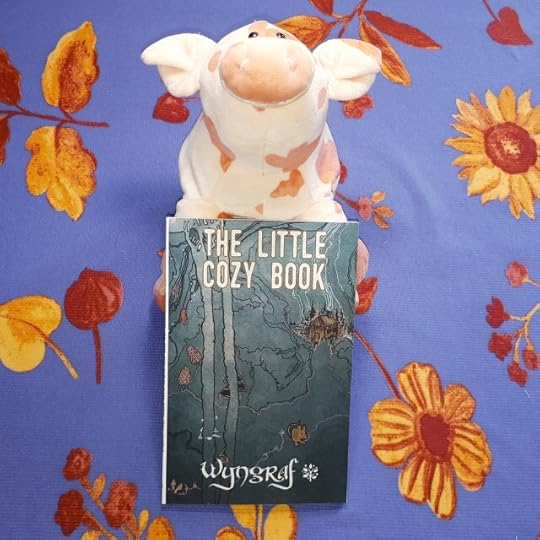 Stuffed pig with The Little Cozy Book