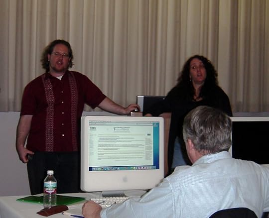 Me and Molly presenting at TechEd in 2005. Weï¿½ï¿½ï¿½re at the front of a darkened conference room and someone in front of us is looking at the World Organization of Webmastersï¿½ï¿½ï¿½ website on a CRT monitor.