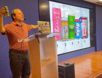 Barry holding pickle seltzer can
