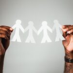 person holding white heart paper