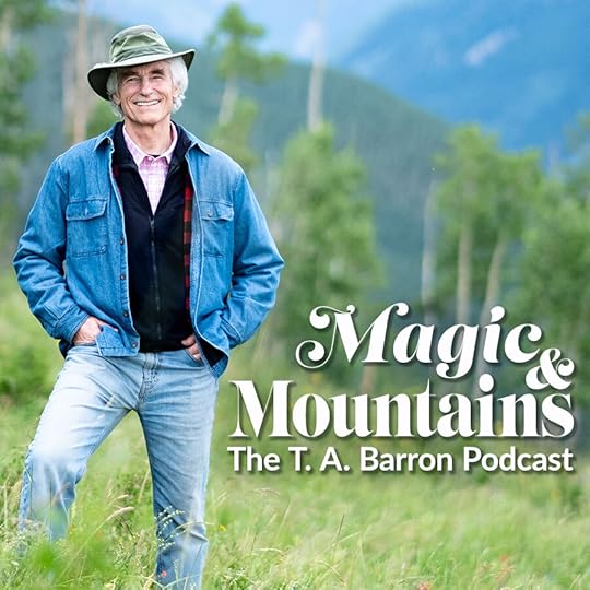 Man with Hat standing in front of mountains and trees