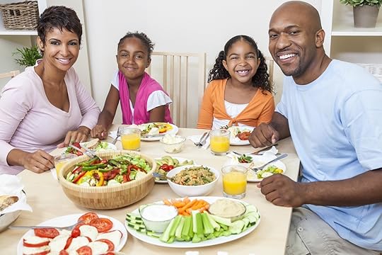 Small family eating a healthy lunch at home.