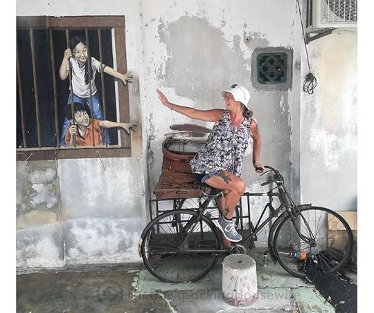 Backpacking Housewife I want bau by artist WK Setor. This mural shows two kids reaching for bao buns