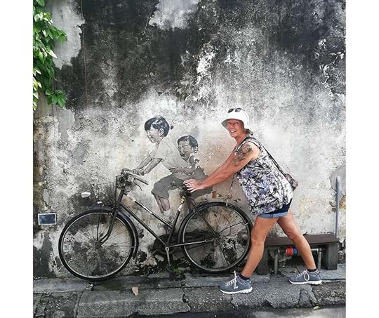 Backpacking Housewife Children on a Bicycle by Ernest Zacharevic: Located on Armenian Street, this mural features two children on a bicycle