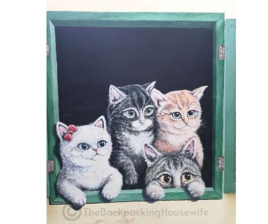 Backpacking Housewife. Cats in a window: Another piece of street art for cat lovers visiting George Town.