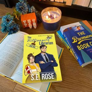The Billionaire and the Librarian book by SE Rose on an open