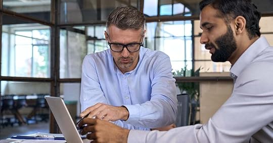 Sales manager reviews pipeline forecasting data with a seller