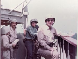 Navy officers and crew on the bridge of a ship