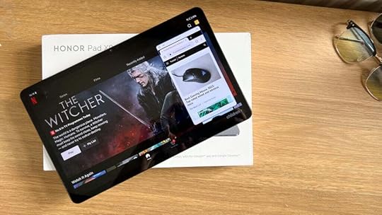 Honor Pad X9 on a table with Netflix on screen