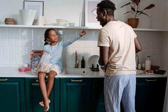a man and a girl in the kitchen areaco-parenting neurodivergent children