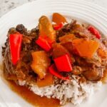 The finished Slow Cooker Huli Huli Chicken served atop of rice