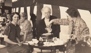 Lettie Cowman has a tea party with two women in China