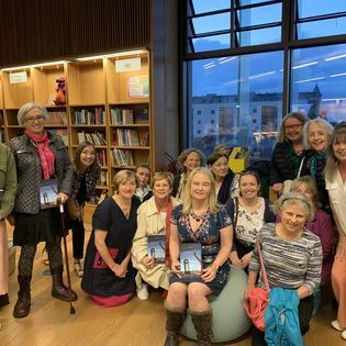 This image has an empty alt attribute; its file name is bookclubatlaunch.jpg