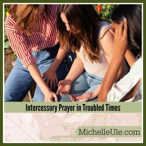 Three women praying together