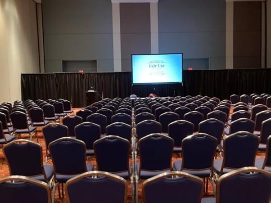 a small screen showing a slide that says 