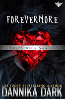 Large beautiful ruby heart lying on a bed of black feathers. Silver banner across the middle reads: A crossbreed series novella