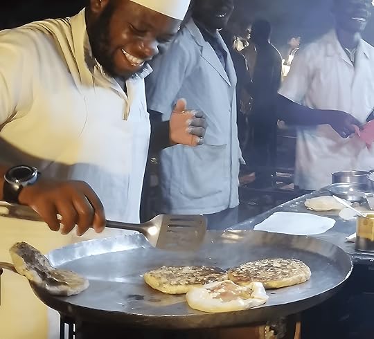 Cooking a Zanzibar Pizza in Forodhani Garden in Stone Town, Zanzibar, Tanzania.
