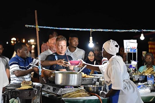 Serving Urojo soup at a food stall at Forodhani Garden in Stone Town, Zanzibar, Tanzania.