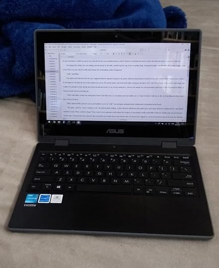 Small laptop with text on screen