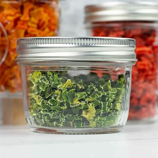 Dehydrated celery in a small glass mason jar.