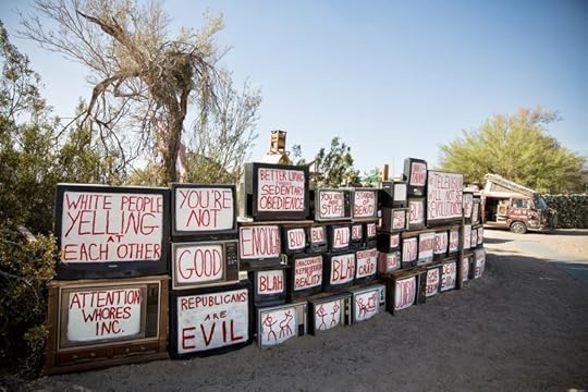 Photo of the TV wall at East Jesus, photo attributable to East Jesus