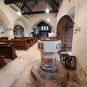 view of chancel from behind font at St Andrew's Leighterton
