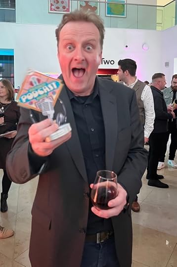Mark Stay gurning for the camera after collecting the award for Best Books Podcast for the Bestseller Experiment. Photo by Simon Brew.