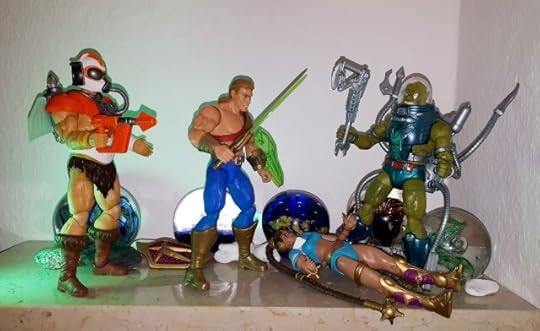 Slush Head has dropped Mara, after she kneed him in the groins, and now attacks He-Man.