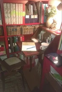 Old upright bureau with paper notebook