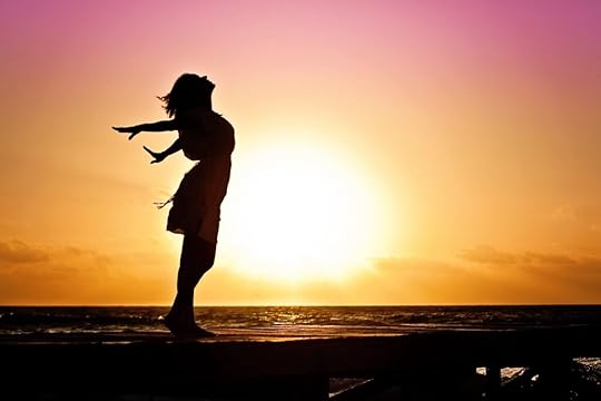 A silhouette of woman looking up to the sky. Change is a YA character development that can authentically connect with readers.