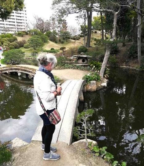 The Backpacking Housewife Janice Horton feeding carp in the Shukkeien Garden Hiroshima Japan