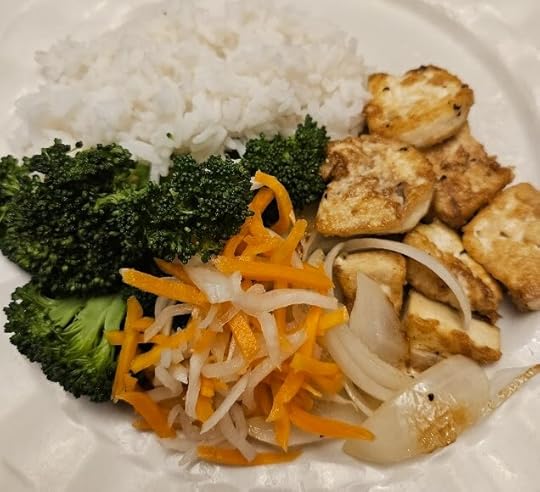 plated food with rice, broccoli, tofu and pickled daikon + carrot relish