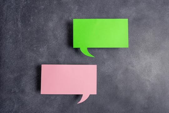 red and green sticky notes as speech bubbles