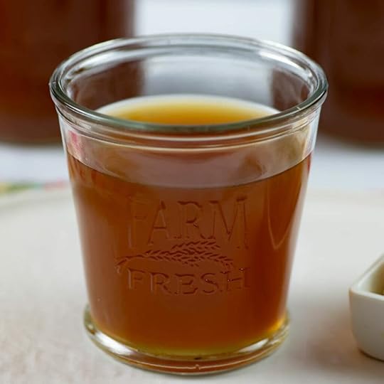 Instant Pot Beef Bone Broth in a glass on a table.