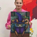 Cat in magician's hat reading a book