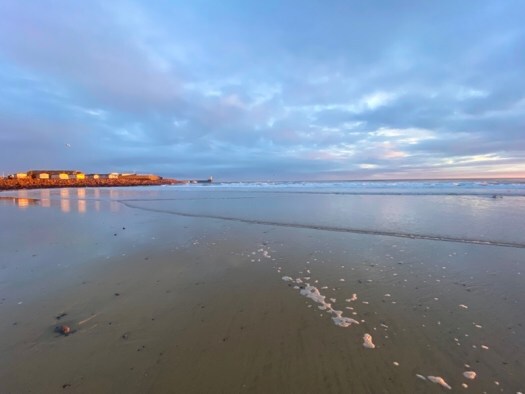 Fraserburgh lit up by the sunrise, view from by Tiger Hill