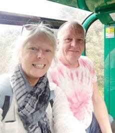 The backpacking housewife and husband on the cable car to Mount Misen Japan