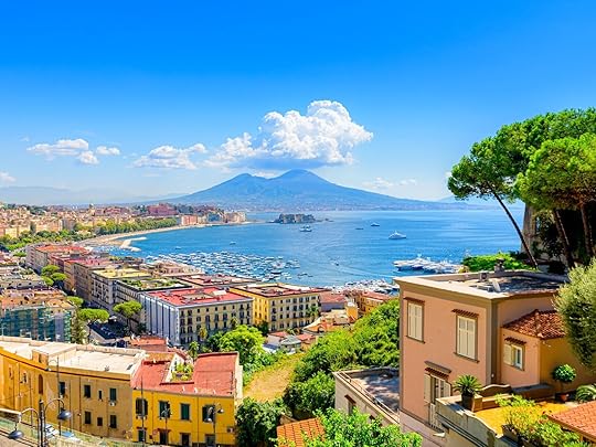 Naples, Italy. View of the Gulf of Naples from the Posillipo hill with Mount Vesuvius far in the background and some pine trees in foreground.